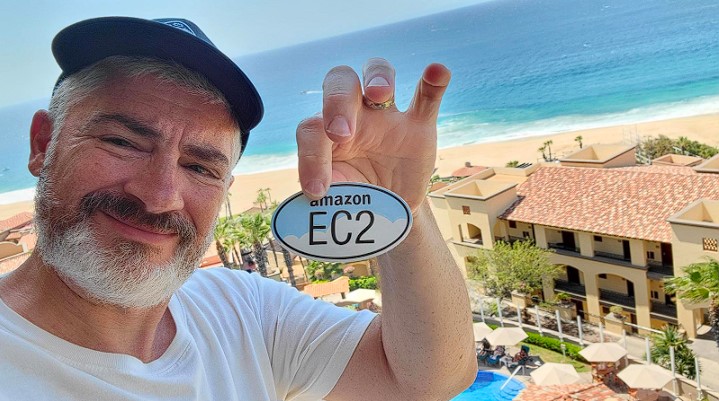 Jeff Barr holding a sticker of AWS EC2 cloud computing